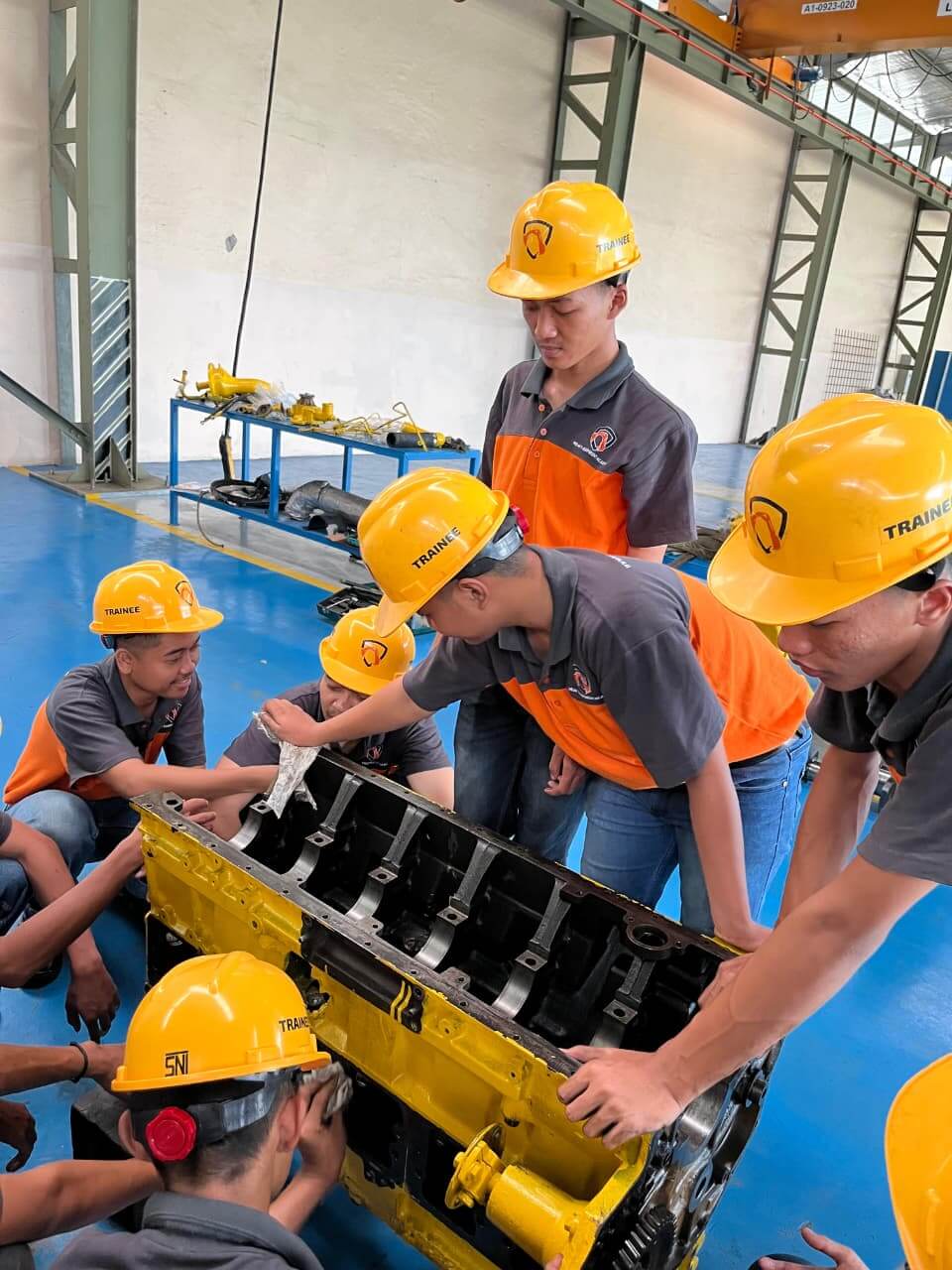 Students wearing safety equipment during training